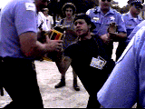 image of cameraman being arrested 
by cops